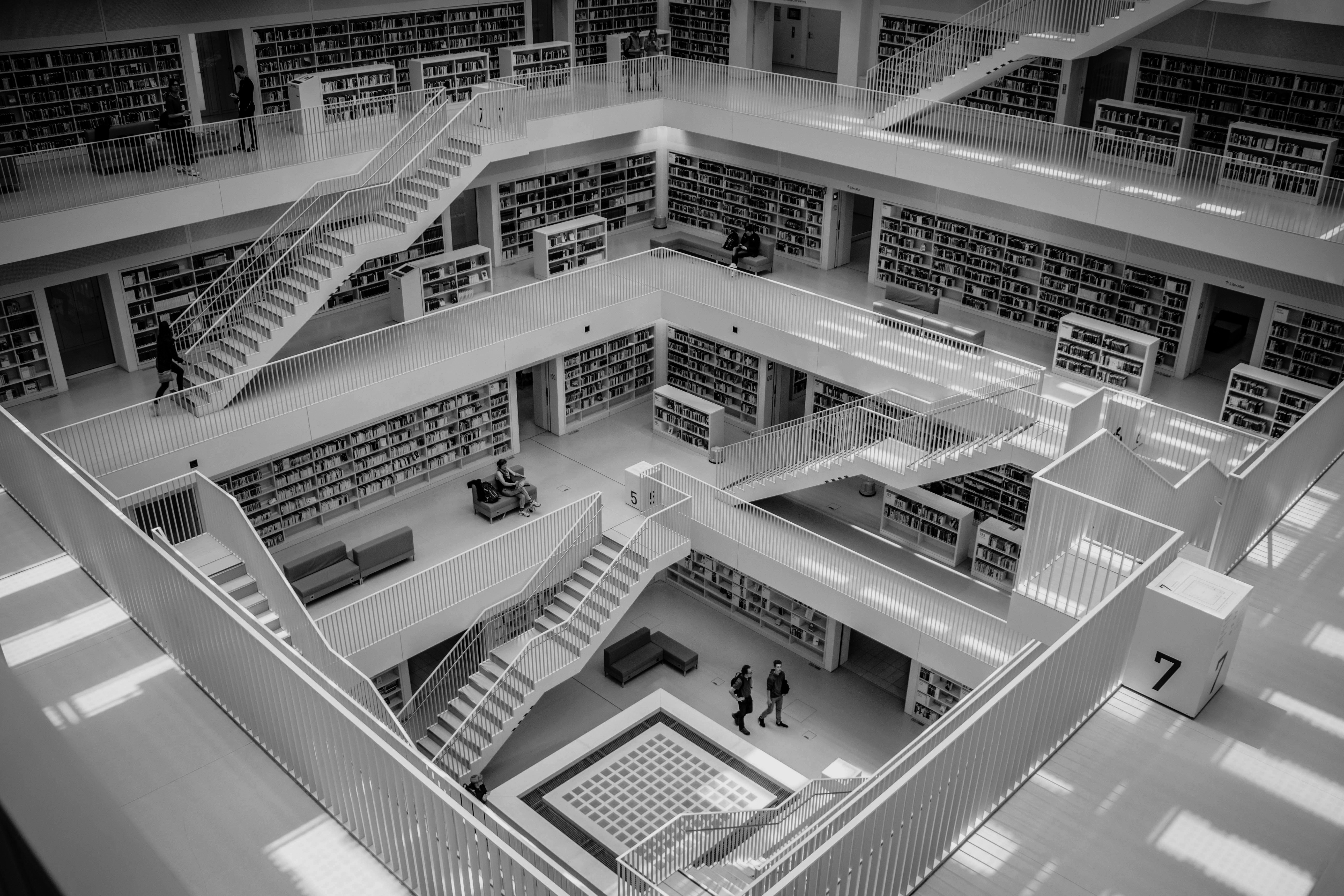 Academic journals: an image of a library with many staircases